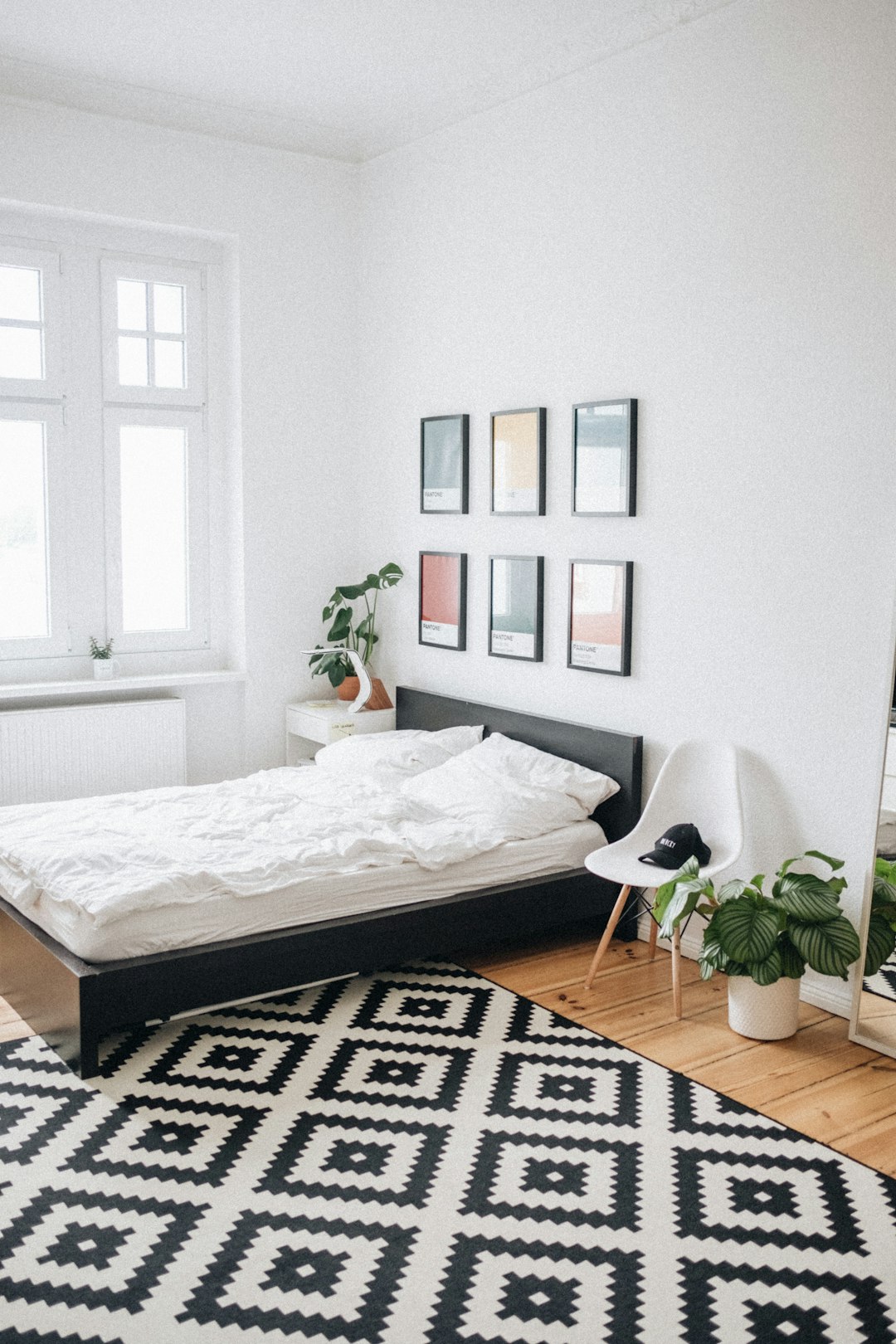 black-platform-bed-with-white-mattress-inside-bedroom-dhfhtkecn7q